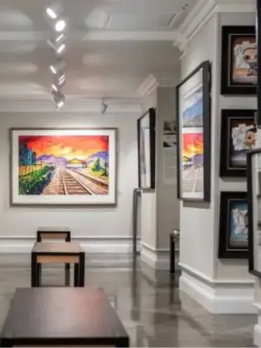 Art gallery with colourful picture on the walls