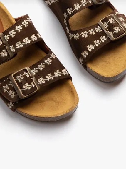 Brown sandals with daisy designs