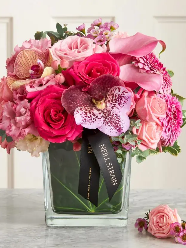 A vase filled with pink flowers