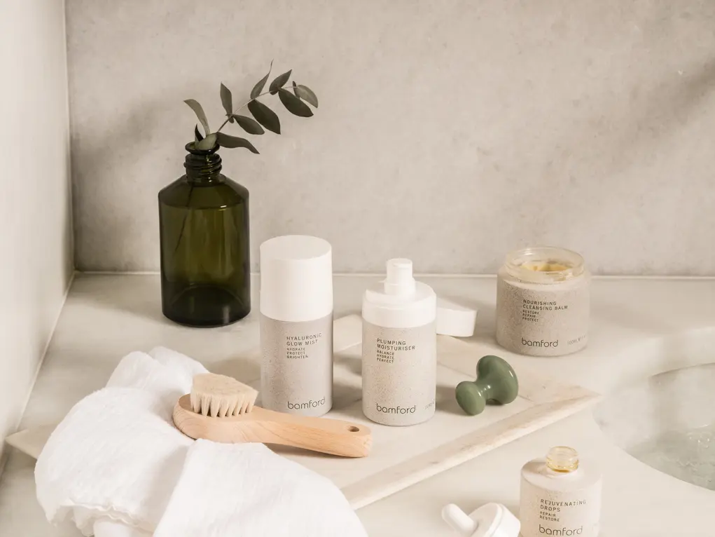 Skincare products in white and green bottles