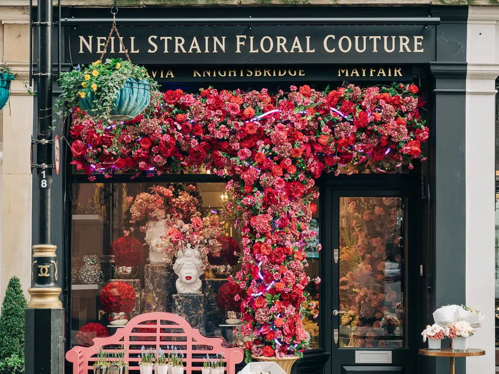Exterior of the Neill Strain florist with a huge flower display